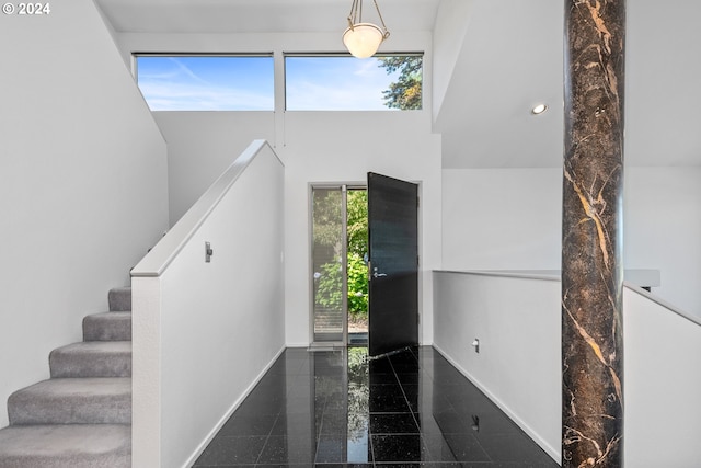 foyer featuring a high ceiling