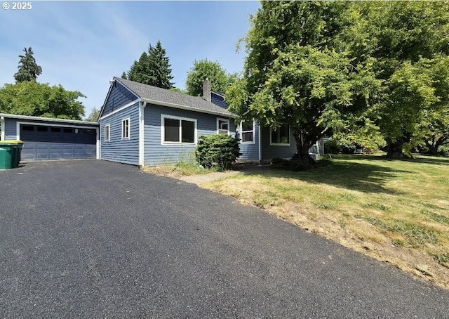 7331 SW Oak St, Tigard, OR 97223 - view of front of property with a chimney, a front yard, a detached garage, and a shingled roof