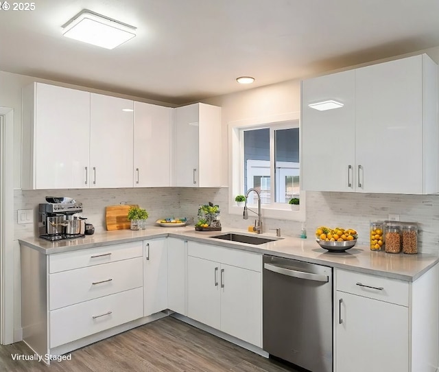 7331 SW Oak St, Tigard, OR 97223 - kitchen with stainless steel dishwasher, light countertops, tasteful backsplash, and white cabinetry