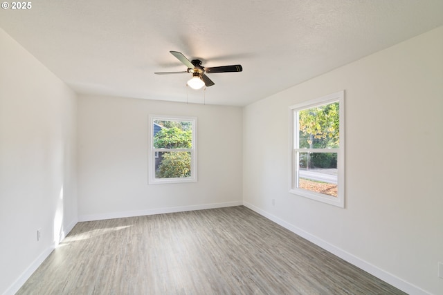 7331 SW Oak St, Tigard, OR 97223 - unfurnished room with healthy amount of natural light, ceiling fan, and wood finished floors