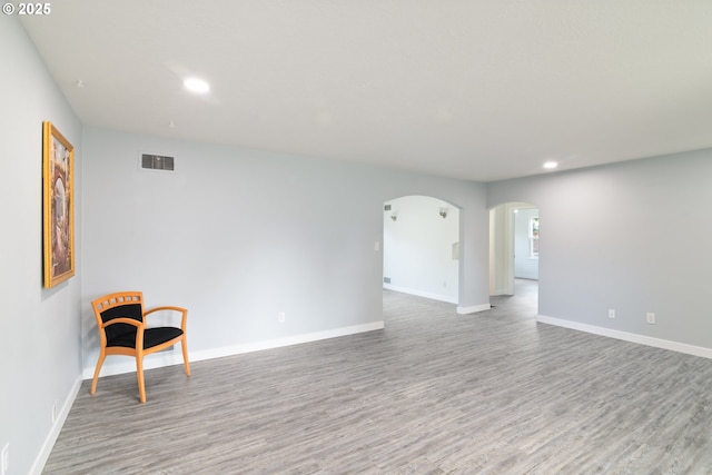 7331 SW Oak St, Tigard, OR 97223 - unfurnished room with wood finished floors, recessed lighting, and arched walkways