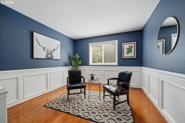 sitting room with light hardwood / wood-style floors