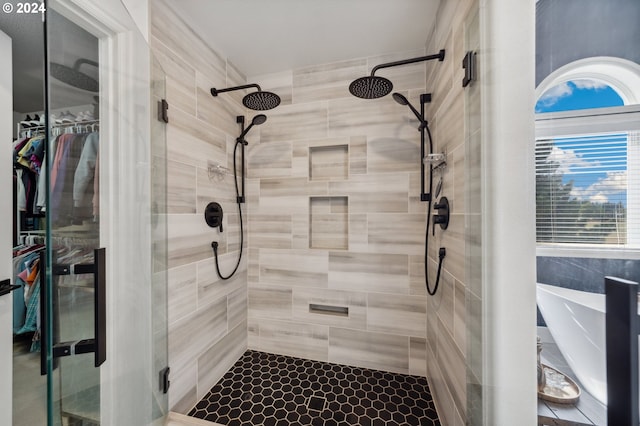 bathroom with a shower with shower door