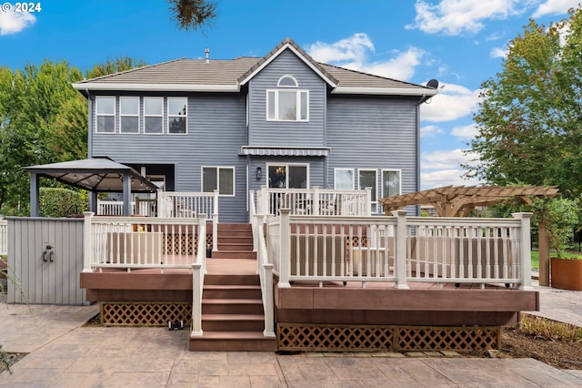 back of house featuring a gazebo, a wooden deck, and a pergola