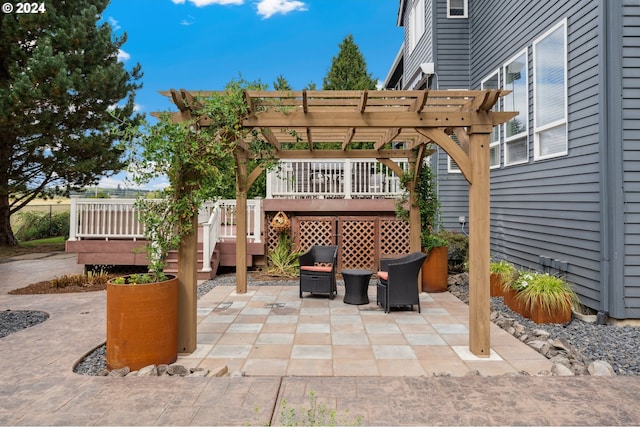 view of patio with a pergola and a wooden deck