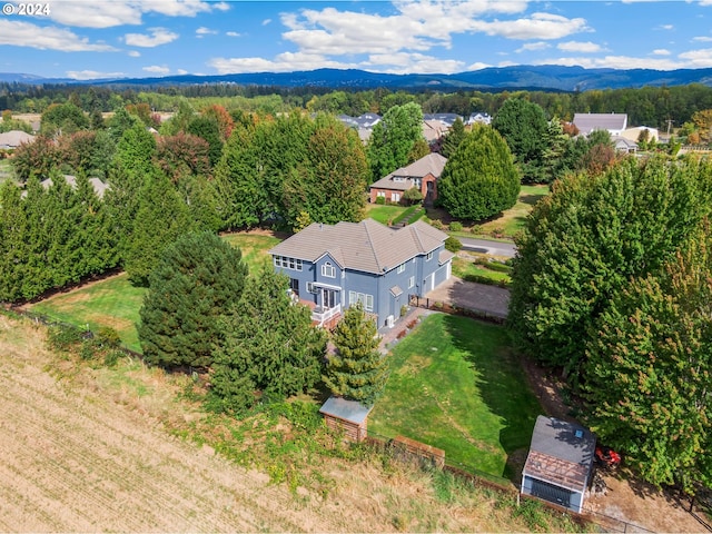 birds eye view of property featuring a mountain view