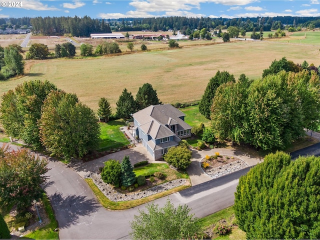 birds eye view of property featuring a rural view