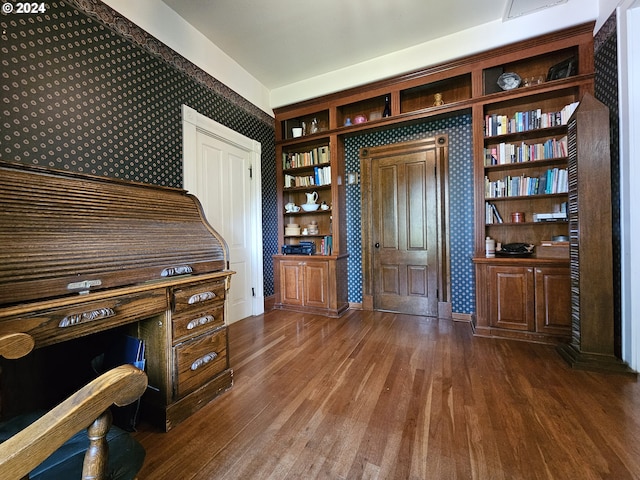 unfurnished office featuring dark hardwood / wood-style floors