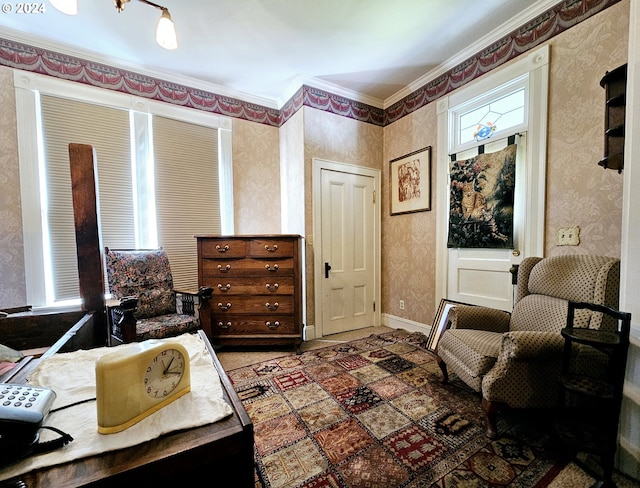 living area featuring ornamental molding