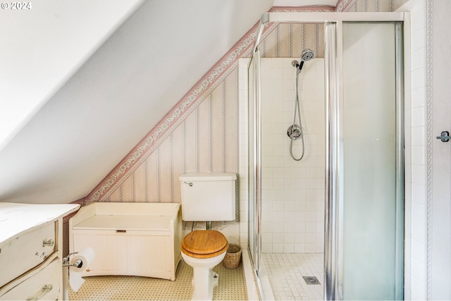 bathroom with walk in shower, vanity, tile patterned flooring, and toilet