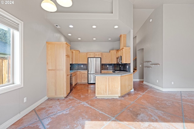 kitchen with tasteful backsplash, light brown cabinetry, light tile patterned floors, and appliances with stainless steel finishes