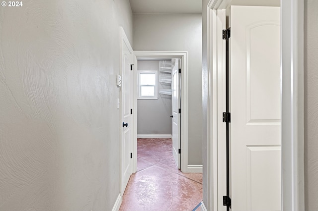 corridor with light tile patterned floors