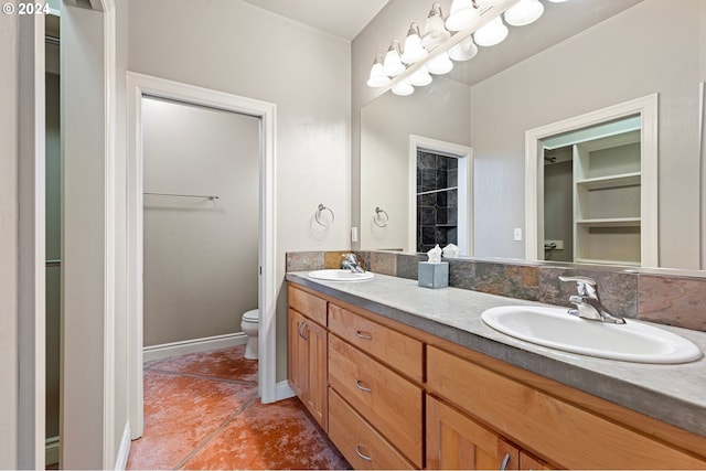 2721 La Darrah St, Eugene, OR 97404 - full bath featuring double vanity, toilet, baseboards, and tile patterned flooring