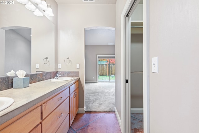 bathroom with tile patterned floors and vanity