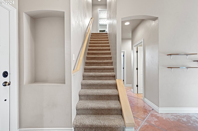 2721 La Darrah St, Eugene, OR 97404 - staircase with arched walkways and baseboards