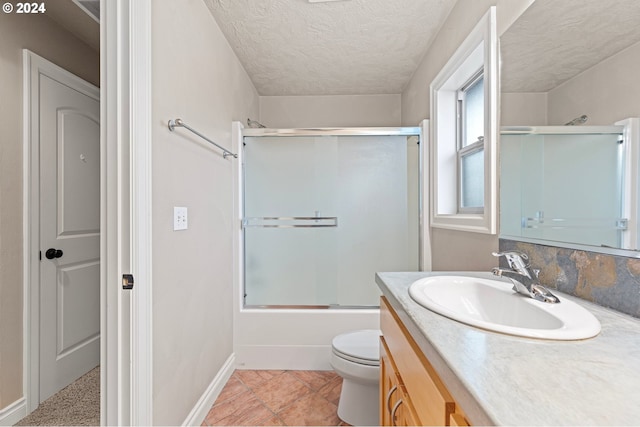 2721 La Darrah St, Eugene, OR 97404 - bathroom with vanity, toilet, shower / bath combination with glass door, baseboards, and a textured ceiling