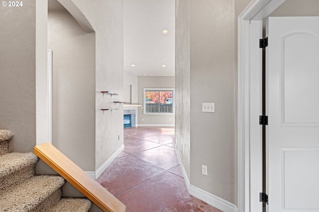 2721 La Darrah St, Eugene, OR 97404 - corridor with arched walkways, concrete flooring, baseboards, stairway, and recessed lighting