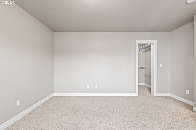 2721 La Darrah St, Eugene, OR 97404 - unfurnished bedroom featuring carpet, a walk in closet, baseboards, and a closet