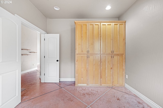 2721 La Darrah St, Eugene, OR 97404 - unfurnished bedroom with finished concrete floors, baseboards, and recessed lighting