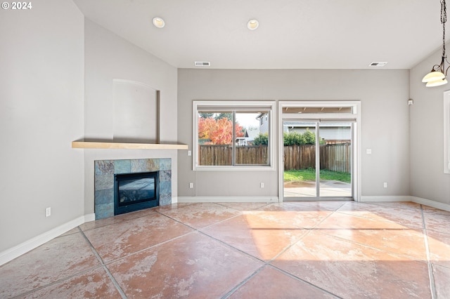 2721 La Darrah St, Eugene, OR 97404 - unfurnished living room with a tiled fireplace, baseboards, and recessed lighting