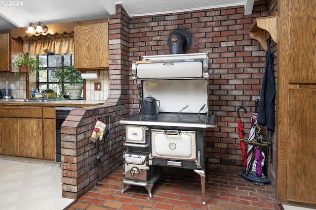 kitchen featuring decorative backsplash and sink