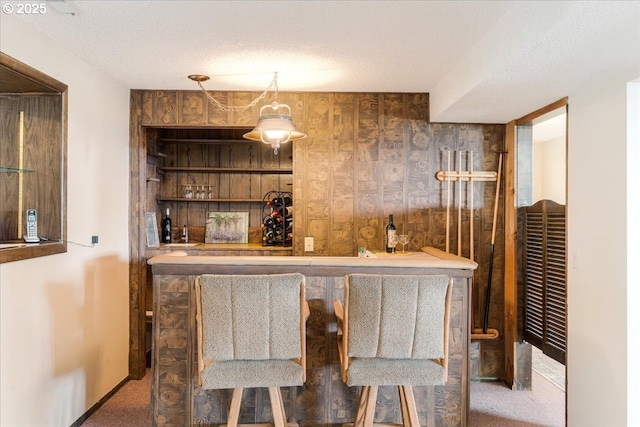 10685 Oak Dr SE, Salem, OR 97306 - bar with baseboards, indoor wet bar, carpet, and a textured ceiling