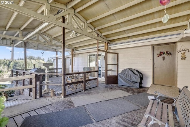 sunroom with lofted ceiling