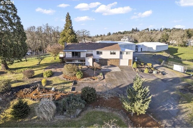 rear view of property featuring a garage