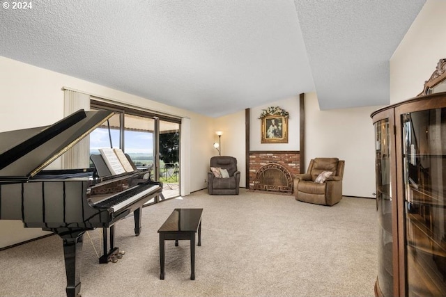 sitting room featuring lofted ceiling, a fireplace, light colored carpet, and a textured ceiling