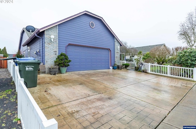 view of property exterior with a garage