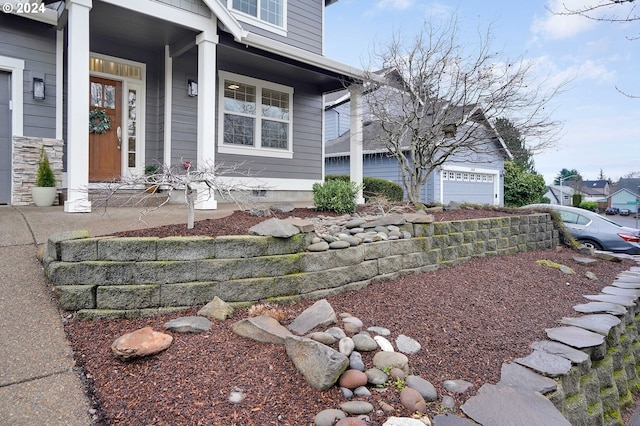 property entrance featuring covered porch