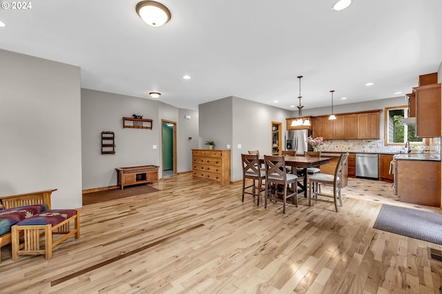 dining room with light hardwood / wood-style flooring