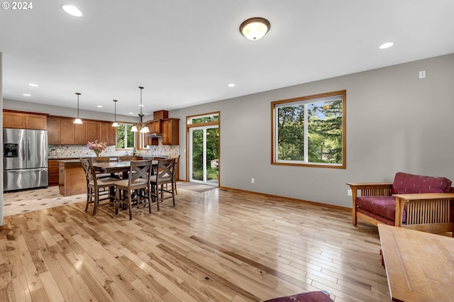 dining area with light hardwood / wood-style flooring