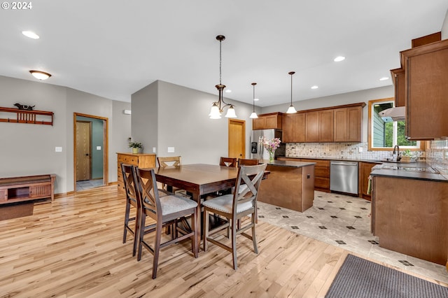 dining space with light hardwood / wood-style floors