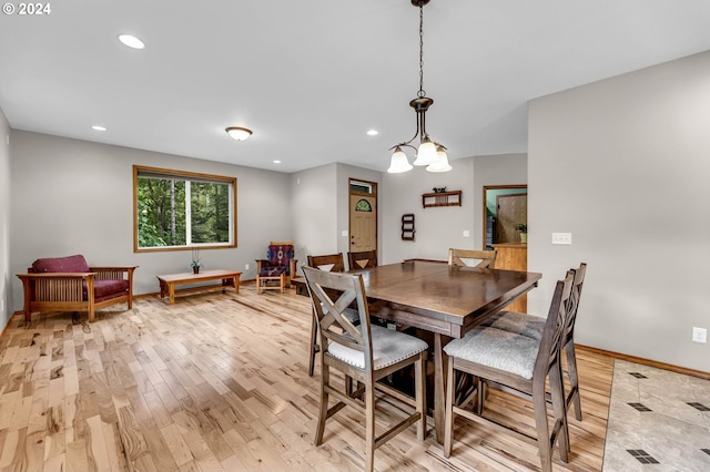 dining space featuring light wood-type flooring