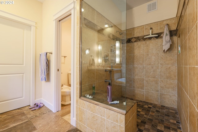 full bathroom with tile patterned floors, enclosed tub / shower combo, toilet, and vanity