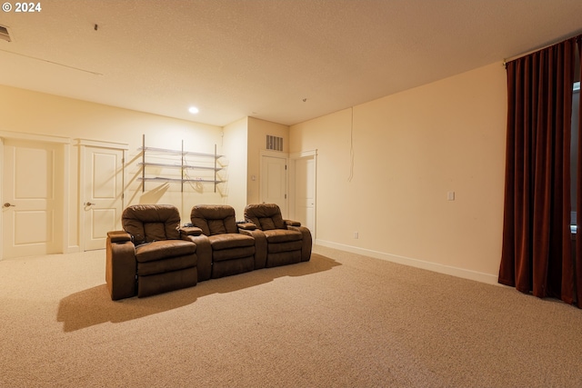 carpeted empty room featuring a textured ceiling