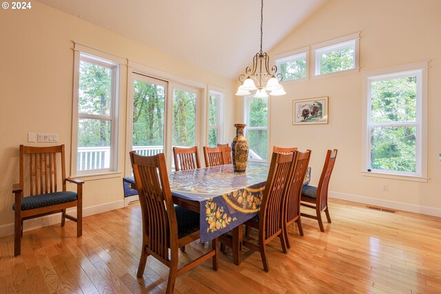 kitchen featuring light tile patterned floors, a center island, wall chimney exhaust hood, and sink