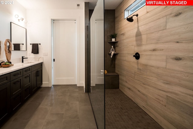 bathroom with vanity, tile patterned floors, and walk in shower