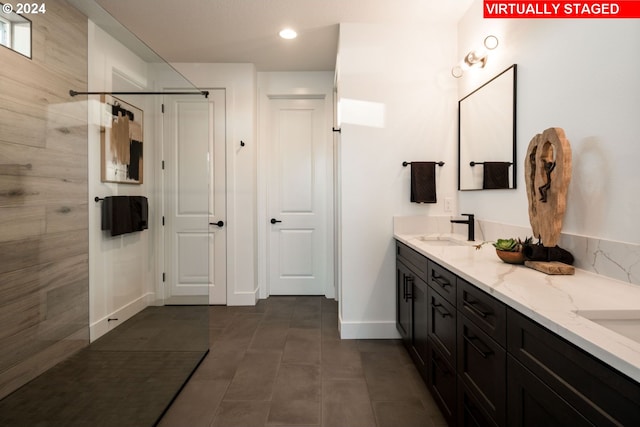 bathroom featuring tile patterned flooring and vanity