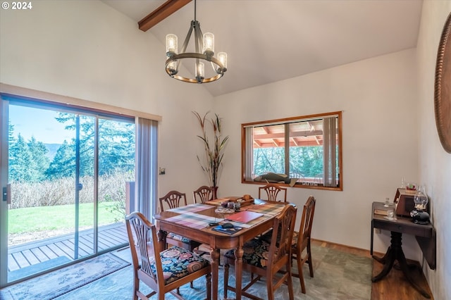 dining area with beam ceiling, high vaulted ceiling, and an inviting chandelier