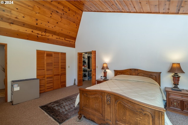 carpeted bedroom featuring vaulted ceiling and wood ceiling