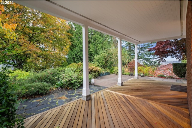 wooden terrace with a patio