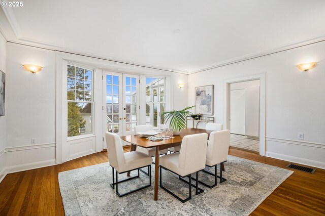 unfurnished room with ornamental molding, french doors, and wood-type flooring