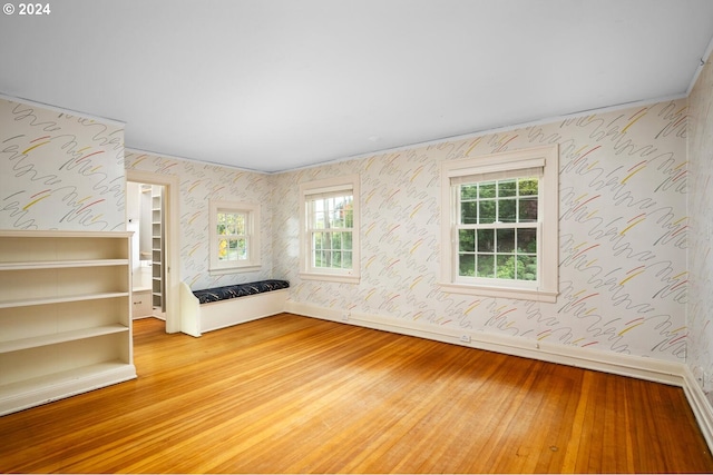 unfurnished living room with wood-type flooring