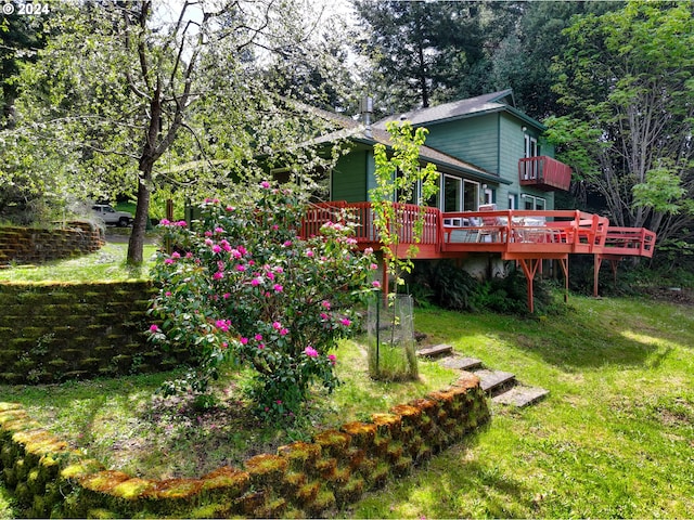 view of yard with a wooden deck