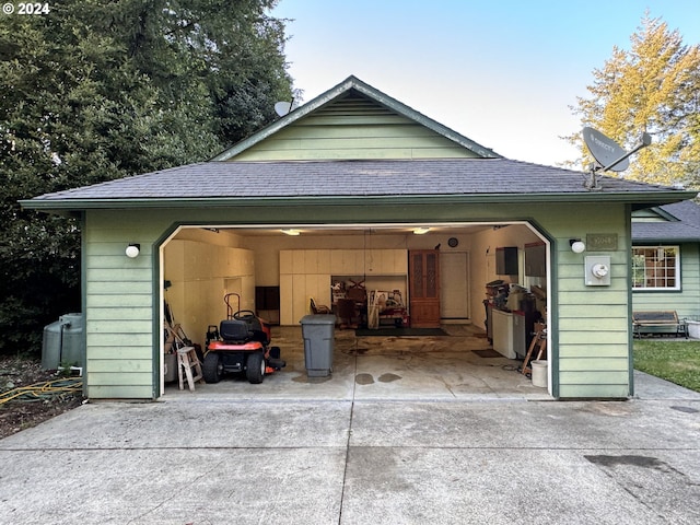 back of property featuring a garage