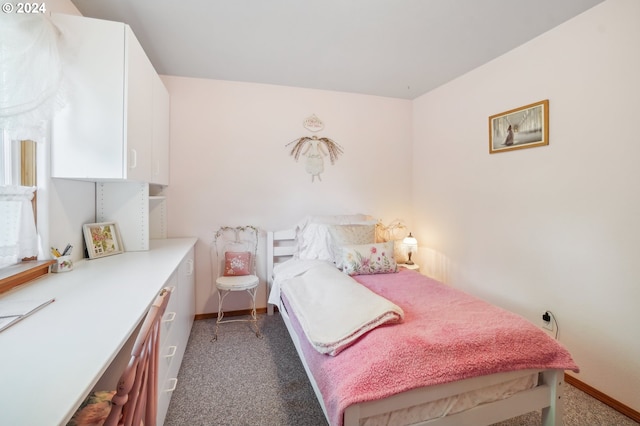 bedroom featuring light carpet