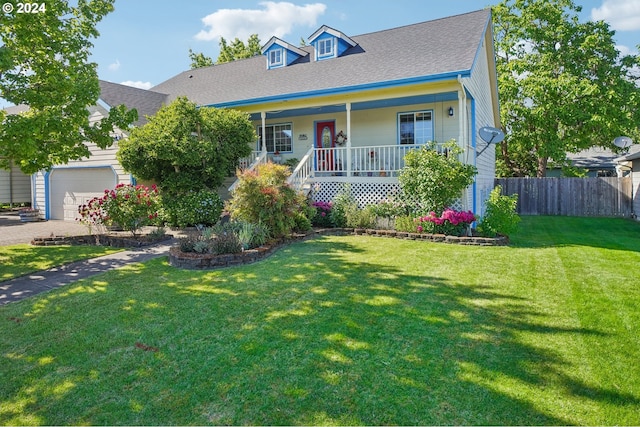 view of front facade with a garage, a front lawn, and a porch