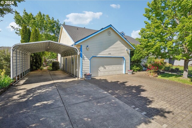 view of property exterior featuring a carport and a garage